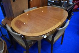 A vintage teak oval extending dining table, probably Nathan/Parker Knoll, approx 152 x 101cm