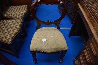 A Victorian balloon back chair with later upholstery