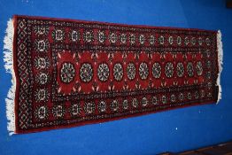 A Persian style rug, approx. 174 x 63cm