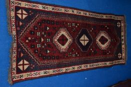 A Persian style rug, approx. 187 x 70cm
