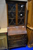 A reproduction mahogany bureau bookcase