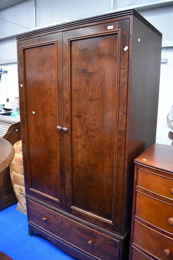 A modern mahogany wardobe with drawer base , dimensions approx. H199 W107cm