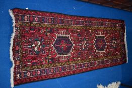 A Persian style rug, approx. 189 x 75cm, labelled Karadja
