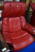 A Stressless swivel chair in red