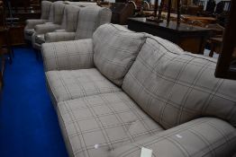 Three modern wing back easy chairs and settee in similar cream check upholstery, settee width approx