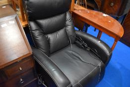 A modern leatherette electric recliner chair