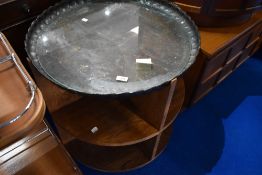 An mid 20th Century golden oak circular shelf table on castors, with adapted Copper table top (