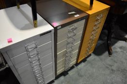 Three sets of metal filing drawers