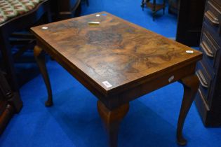An early 20th Century walnut topped coffee table on cabriole legs, approx 67 x 42cm