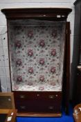 A Victorian mahogany wardrobe having internal drawers and later papered decoration