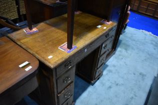 A period style golden oak kneehole desk by Tudor Oak, approx 83 x 51 x 76cm