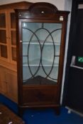 An Edwardian mahogany corner display, some damage to glass, height approx. 193cm