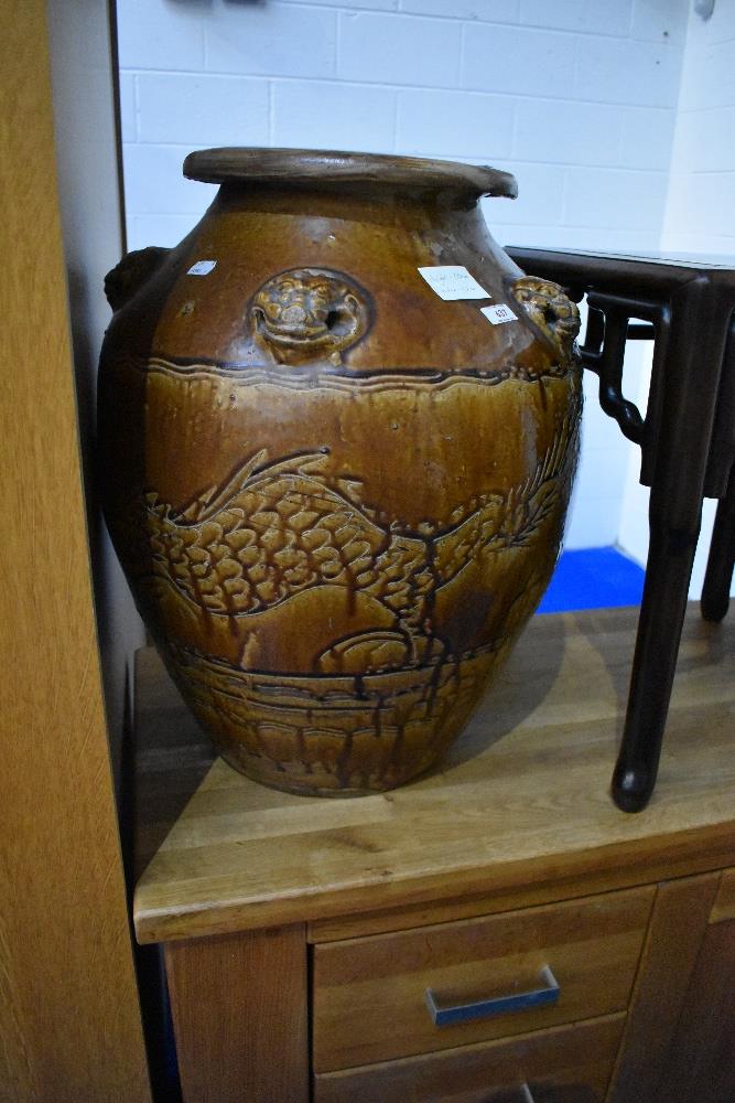 An oversized decorative salt glazed vase in the Chinese style , with damage to base, height approx