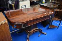 A William IV mahogany fold over tea/breakfast table of large proportions , having curved top over