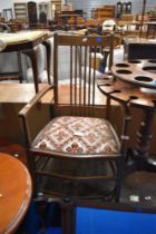 An Edwardian mahogany carver chair