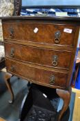 A reproduction dwarf chest of three drawers, on cabriole legs, approx W51 D39 H73cm