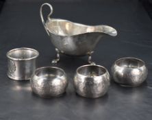 A George V silver sauce boat, of traditional form with shaped rim, loop handle and cabriole type