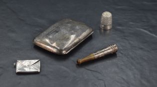 A Sterling grade white metal stamp case, typically formed as an envelope with engraved foliate