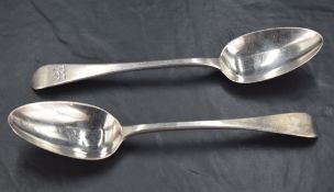 Two near matching William IV silver Old English pattern spoons, engraved with lion passant crest,