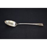 A George III silver Old English pattern basting spoon, engraved with lion passant crest to terminal,