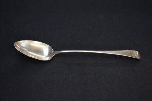 A George III silver Old English pattern basting spoon, engraved with lion passant crest to terminal,