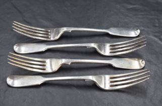 A group of four Victorian silver Fiddle Pattern forks with Hanoverian terminals and engraved initial