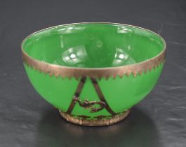 An early 20th century Chinese white metal mounted green glass bowl, of dished circular form with