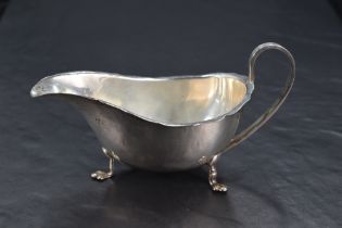 A George VI silver sauce boat, of traditional design with short flared and shaped rim, generous