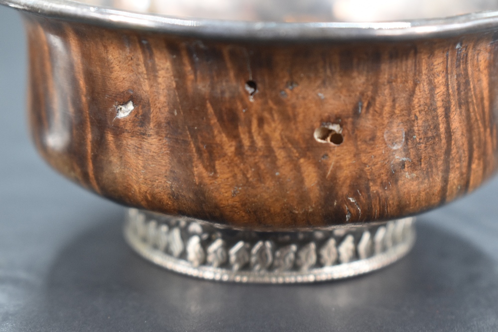 A 19th century Chinese/Tibetan white metal mounted Mazer bowl, of turned form with white metal - Image 4 of 4