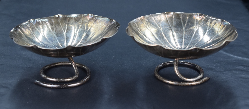 A pair of late 19th/early 20th century Chinese white metal dishes, of dished lily pad form with
