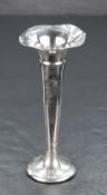 An Edwardian silver bud vase, of flared and tapering cylindrical form with moulded collar and