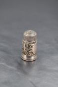 A George III miniature white metal and glass combination scent bottle and thimble, the bottle having