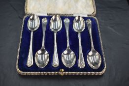 Golfing interest*A cased set of six George V silver coffee spoons, the trefoil surmounts with
