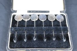 A cased set of six George V silver coffee bean spoons, of traditional form with shallow circular