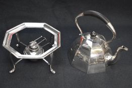 An attractive silver-plated spirit kettle on stand of domed octagonally faceted form with arched