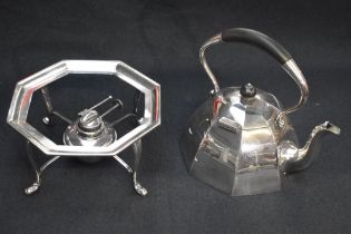 An attractive silver-plated spirit kettle on stand of domed octagonally faceted form with arched