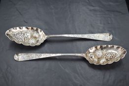 A late George II silver 'Berry' spoon, Hanoverian pattern with later embossed and engraved