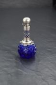 A late Victorian silver mounted and cut-blue glass scent bottle, of onion form with elongated and