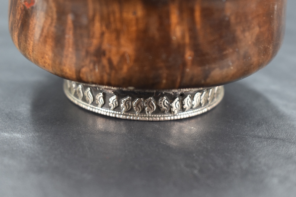 A 19th century Chinese/Tibetan white metal mounted Mazer bowl, of turned form with white metal - Image 2 of 4