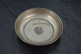 A Turkish/Ottoman 800 grade white metal coin dish, of circular form with moulded rim and repeating