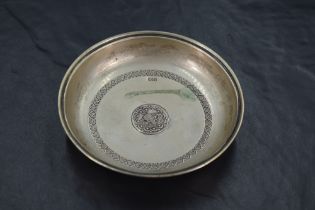 A Turkish/Ottoman 800 grade white metal coin dish, of circular form with moulded rim and repeating