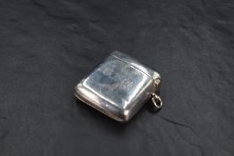 An Edwardian silver Vesta case, of traditional design and curved for the gentleman's pocket,