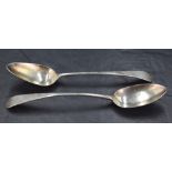 Two George III provincial silver Old English pattern table spoons, slight difference in size, 23cm x