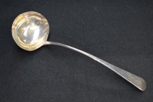 A George III silver Old English pattern ladle, the terminal engraved with lion and banner crest