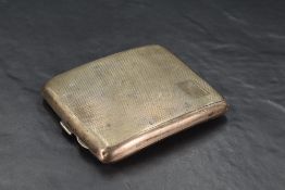 A George VI silver cigarette case, of hinged rectangular form curved for the gentleman's pocket