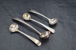 A group of four Georgian silver condiment spoons, each being Old English pattern variants, marks for