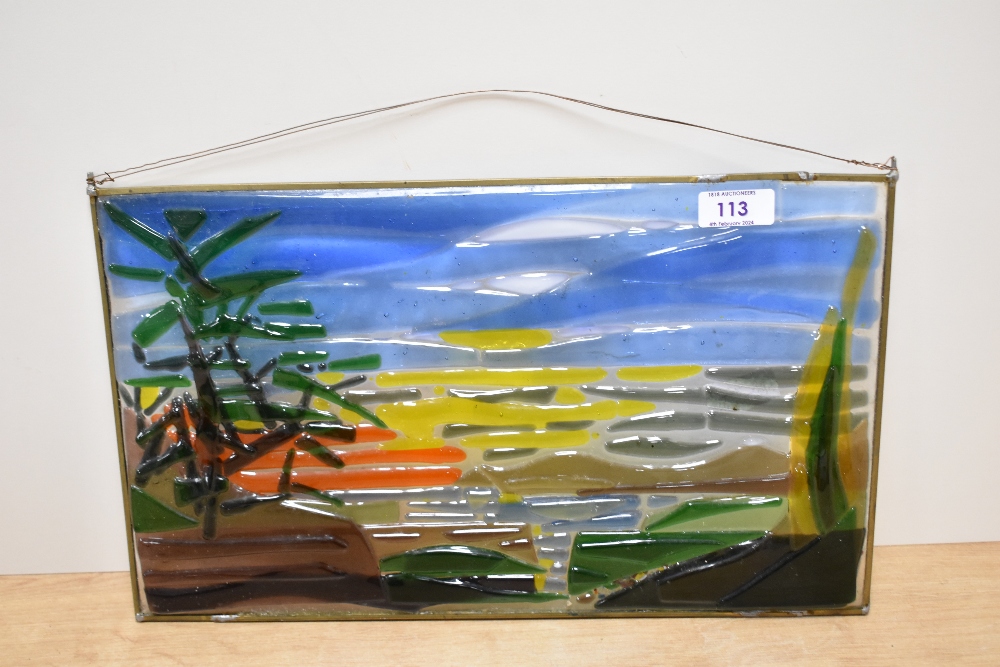 A studio Art glass panel, depicting coastal landscape, having textured finish.