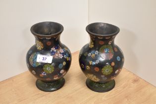 A pair of Japanese Cloisonne enamelled vases, Meiji period, measuring 17cm tall