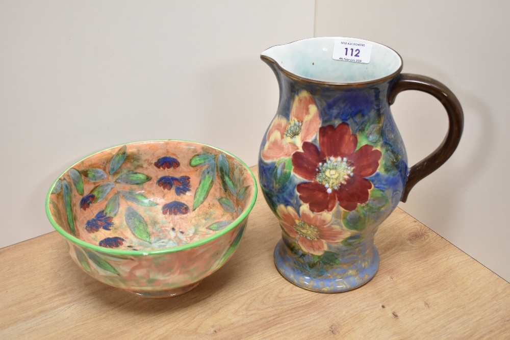 A Royal Doulton wild rose patterned jug and a Royal Doulton bowl with floral design on peach