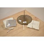 An antique brass sundial, having Welsh dragons to centre, approx 17cm, sold with a Heliograph